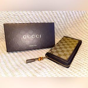 Authentic Gucci - canvas and leather, bamboo tassel, zip around wallet.